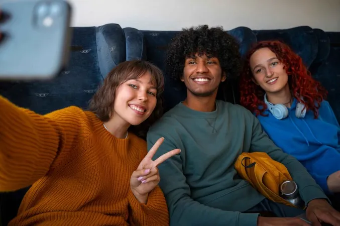 Friends taking a selfie together using a smartphone Friends taking a selfie together using a smartphone