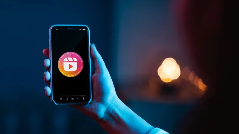 Smartphone screen displaying the Instagram Reels icon. Smartphone screen displaying the Instagram Reels icon.
