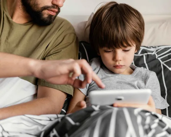 Father and son use tablet Father and son use tablet
